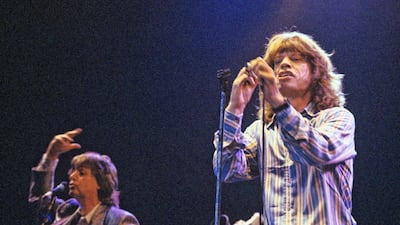 Sir Paul McCartney, left, and Sir Mick Jagger performed together at Wembley Arena, London, in 1986. Getty Images