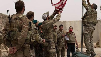 US soldiers lower American flag over base in Afghanistan during handover. AFP/Afghanistan's Ministry of Defence