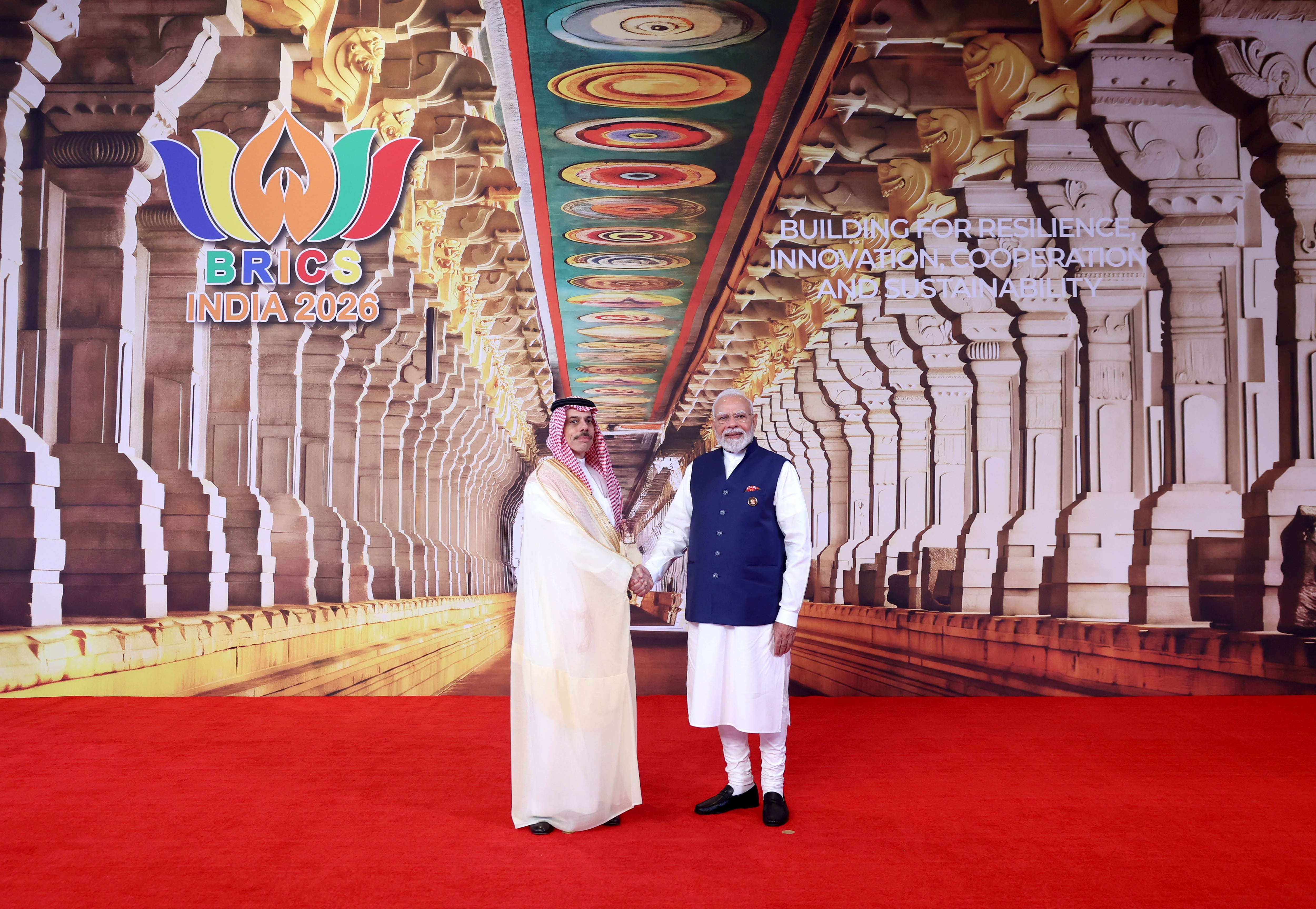 Saudi Foreign Minister Prince Faisal bin Farhan with Mr Modi on the final day of the Brics Summit in India's capital city. EPA