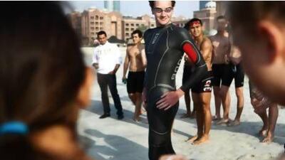 Olmpic gold medallist Alistair Brownlee talks with local students during a triathlon training session at Emirates Palace on Wednesday. Delores Johnson / The National
