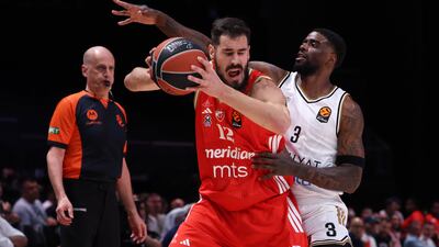 Dwayne Bacon of Dubai Basketball and Crvena Zvezda's Nikola Kalinic. EPA