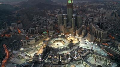 An aerial view of the Abraj al-Bait Makkah Royal Clock Tower overlooking the Grand Mosque and Kaaba in Makkah in the early hours of Eid Al Fitr as Saudi Arabia began a five-day, round-the-clock curfew. AFP