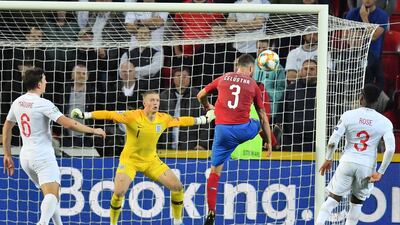 Czech Republic's Ondrej Celustka fails to score past England's goalkeeper Jordan Pickford during the UEFA Euro 2020 qualifier Group A football match Czech Republic v England at the Sinobo Arena. AFP