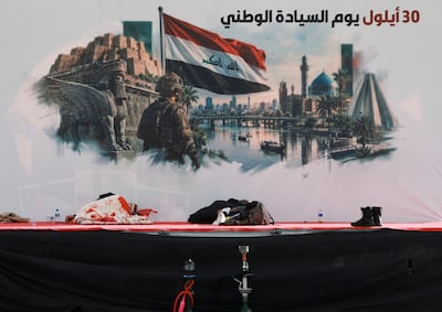A stage with a banner for Sovereignty Day, held on September 30 to mark the withdrawal of US-led coalition forces from Iraq, in Baghdad. Reuters