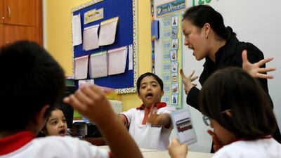 Kismette Riguerra, teacher at junior 1, English class, interacts with children at Future Rehabilitation Centre at Mohammed bin Zayed City in Abu Dhabi. Ravindranath K / The National