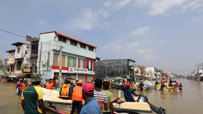 Rescue workers move Colombo residents to safety. EPA