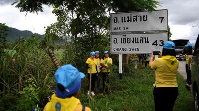 Volunteers planting trees near the Tham Luang cave complex. AFP