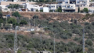 An Israeli army vehicle guards the Israeli settlement of Bruqin in the occupied West Bank. AFP