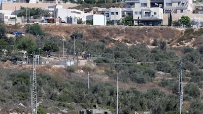 An Israeli army vehicle guards the Israeli settlement of Bruqin in the occupied West Bank. AFP