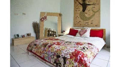 Emily bought the Ali Lamu artwork above her bed on a trip to Kenya. Antonie Robertson / The National