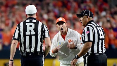 Head coach Dabo Swinney of the Clemson Tigers argues a call with the referees against the Alabama Crimson Tide in the first half during the 2016 College Football Playoff National Championship Game at University of Phoenix Stadium on January 11, 2016 in Glendale, Arizona. Harry How/Getty Images/AFP