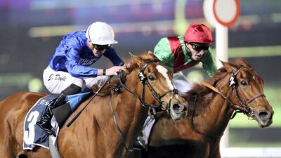 Magic Lily, left, ridden by James Doyle, races to victory at Meydan. Chris Whiteoak / The National