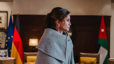 Queen Rania in an asymmetric Ferragamo coat in grey herringbone tweed. Photo: Ferragamo