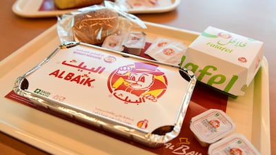 Al Baik’s famous red, yellow and white logo is a bird in a top hat