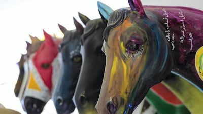 Brightly painted statues of horses sit outside the trainers' and jockeys' room in Dubai. All photos by Chris Whiteoak / The National