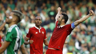 Sevilla's Vicente Iborra celebrates his team's victory at the end of the Primera Liga match against Real Betis at Benito Villamarin Stadium in Seville, Spain on Saturday, February 25, 2017. Nuno Veiga / EPA