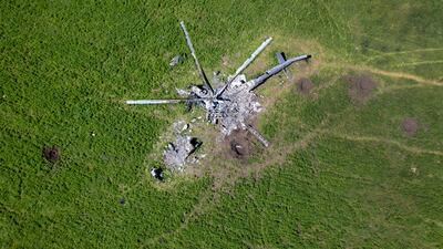 The remains of a Russian helicopter in a field in Biskvitne, Ukraine to the east of Kharkiv. Ukrainian and western officials say Russia is withdrawing forces around Kharkiv, suggesting it may redirect troops to Ukraine's south-east. Getty Images