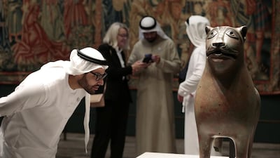 Mohamed Khalifa Al Mubarak, Chairman of Abu Dhabi Tourism and Culture Authority looks at the Monumental Lion sculpture on view at Louvre Abu Dhabi in February 2018. Christopher Pike / Reuters