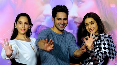 Bollywood actors Nora Fatehi, Varun Dhawan and Shraddha Kapoor pose for photographs during the trailer launch of the upcoming Hindi dance film 'Street Dancer 3D' in Mumbai on December 18, 2019. AFP
