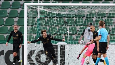 Riqui Puig of Barcelona celebrates with team mate Antoine Griezmann after scoring. Getty