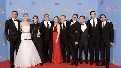 Cast and producers of American Hustle, winners of Best Motion Picture - Musical or Comedy for American Hustle, pose in the press room during the 71st Annual Golden Globe Awards held at The Beverly Hilton Hotel. Getty Images / AFP