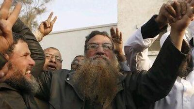Abboud El Zomor surrounded by family members after being released from Liman Tora Prison on March 12, 2011. El Zomor was jailed for involvement in the 1981 assassination of the former Egyptian president Anwar Sadat. Mohamed Abd El-Ghany / Reuters
