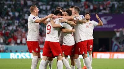 Poland's Piotr Zielinski celebrates with teammates after scoring the first goal in the Group C match against Saudi Arabia at Education City Stadium on November 26, 2022. Getty
