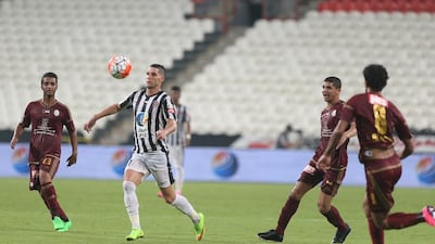 Al Jazira midfielder, second left, controls the ball against Al Wahda during an Arabian Gulf League match on September 18, 2015. Delores Johnson / The National