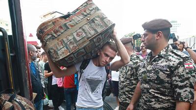 A Syrian man carries luggage as refugees prepare to leave the Lebanese capital, Beirut to return to their homes in Syria. AFP