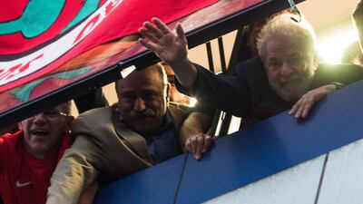 Former President Luiz Inacio Lula da Silva greets his supporters from a window of the Metalworkers' Union in Sao Bernardo do Campo, Brazil. Victor Moriyama/ Getty Images