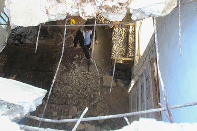 A man inspects damage at his house left by a rocket following Israeli air strikes in Al Qulaylah, on the outskirts of the city of Tyre, south of the Lebanese capital Beirut on April 7. AFP