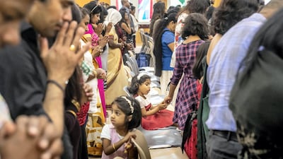 Children attend the Sri Lankan Mass on Christmas day at St Francis Church in Jebel Ali. Antonie Robertson / The National