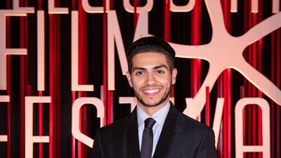 Egyptian Canadian actor Mena Massoud is pictured on the red carpet.