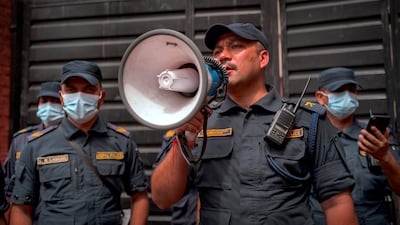 Police control the crowd outside Maharajgunj Medical Campus.