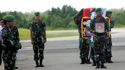 Indonesian soldiers carry the coffin of Sergeant Sertu Handoko who was killed during a battle with a separatist group, suspected of killing at least 19 workers building a bridge in Indonesia's eastern province of Papua, at the airport in Sorong, West Papua, Indonesia December 6, 2018 in this photo taken by Antara Foto. Antara Foto/Olha Mulalinda/ via REUTERS ATTENTION EDITORS - THIS IMAGE WAS PROVIDED BY A THIRD PARTY. MANDATORY CREDIT. INDONESIA OUT.