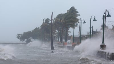 Waves crash against the sea wall in Fajardo, Puerto Rico. Alvin Baez / Reuters