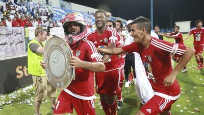 Al Jazira players celebrate winning the 2016/17 Arabian Gulf League title. Hassan Al Raisi / Aletihad
