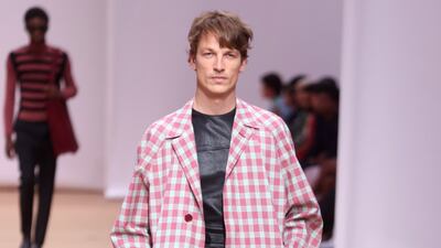 Gingham worn as coats over shorts for Prada spring/summer 2023. Photo: EPA