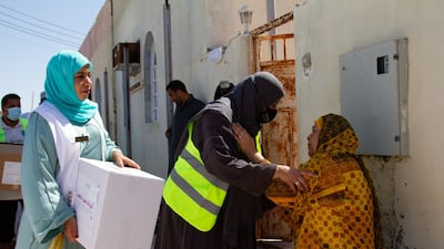 Ahad Foundation volunteers distribute aid to residents of the town of Al Musannah in Oman's Al Batinah region. Photo: Ahad Foundation