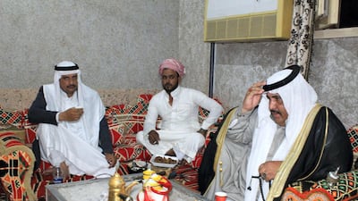 Bedouin men drink coffee and talk late into the night after Iftar. Yusri Mohammad