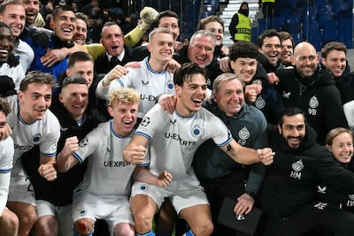 Club Brugge's players celebrate after advancing to the last 16 stage. AFP
