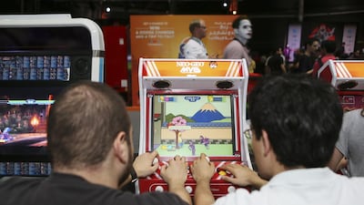 Gamers enjoy vintage video games at the IGN Convention. Sarah Dea / The National