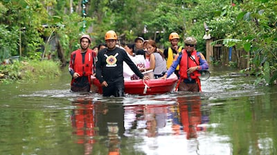 Rescuers leave the southern island of Mindanao. AFP