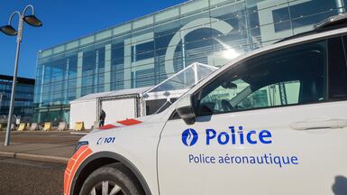 A police car outside Liege Airport on Friday morning after a drone sighting was reported. EPA