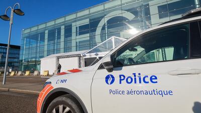 A police car outside Liege Airport on Friday morning after a drone sighting was reported. EPA