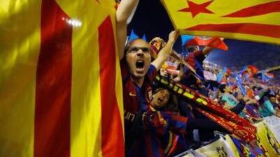 Barcelona fans wave pro independence Catalonia flags during the Copa del Rey final against Real Madrid. Andres Kudacki / AP Photo