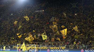 Borussia Dortmund fans show their support prior to the Champions League Group F match against Real Madrid. Dean Mouhtaropoulos / Getty Images