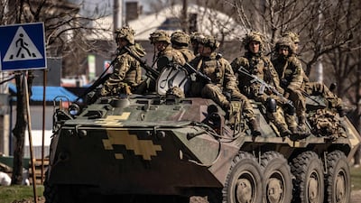 Ukrainian soldiers sit on an armoured vehicle in the city of Severodonetsk, in the Donbas region, on April 7. AFP