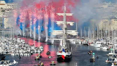 French 19th-century three-masted barque Belem arrives at the Vieux-Port, Marseille carrying the Olympic flame. AFP