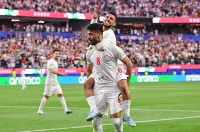 Iran's Mohammad Mohebbi celebrates scoring his team's second goal. AFP